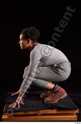 Whole Body Woman Black Sweatshirt Trousers Average Kneeling Studio photo references